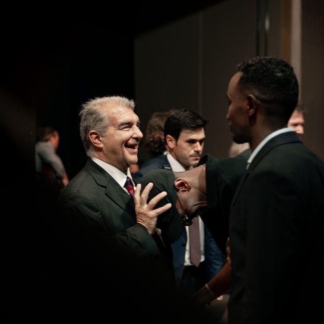 Nasir Hassan sharing a laugh with the President of FC Barcelona