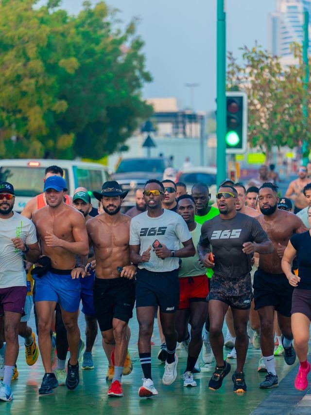 A Collective 365 group running through a Dubai street